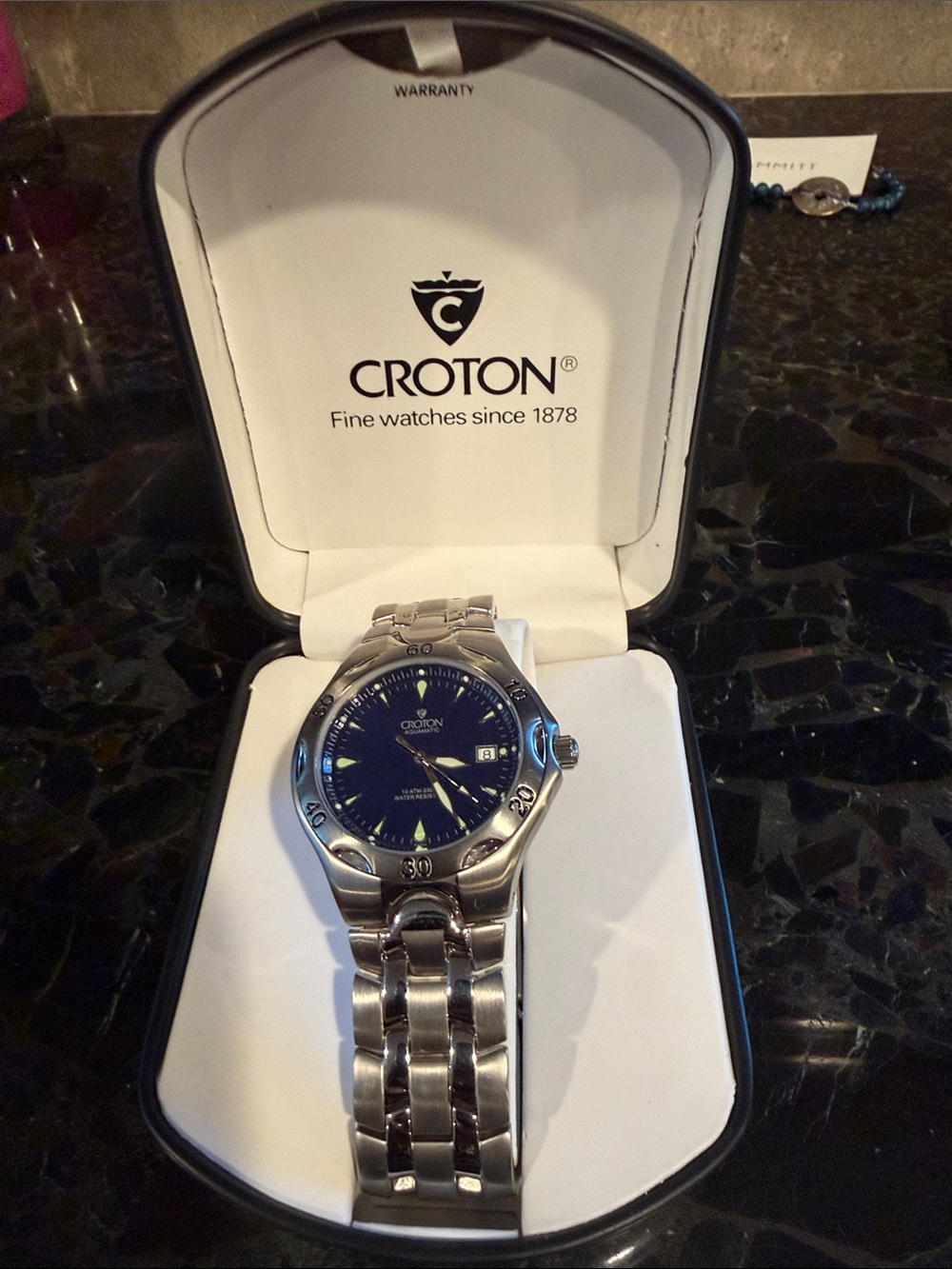 Croton Men’s Silver Watch Water resistant with Black Dial